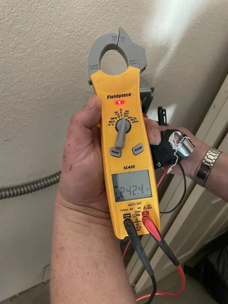 Voltage testing with clamp meter during Electrical Installation Services in Robeson